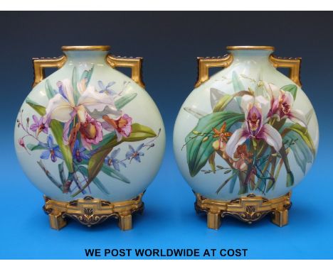 A c1880 pair of Aesthetic period Royal Worcester hand painted moon flasks with orchid decoration, KS initial to base 23cm tal