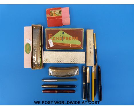 A collection of pens including Conway Stewart, Parker etc, Hohner bakelite harmonica and two others 