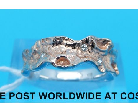 An yellow metal ring marked 18ct set with diamonds (size K)