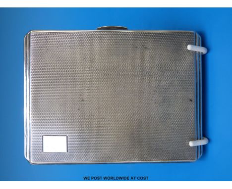 A hallmarked silver cigarette case with engine turned Art Deco decoration, Birmingham 1949, maker Smith & Bartham (166g)