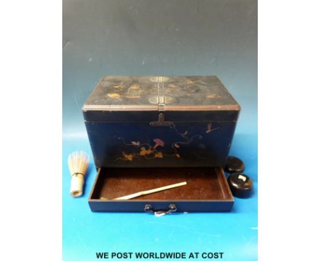 A Japanese lacquer tea caddy with gilt decoration and drawer below, width 30cm