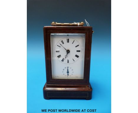 A Rollin of Paris rosewood and brass inlaid cased alarm carriage clock (height 18cm)