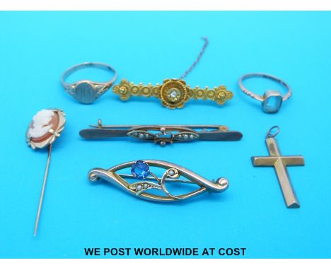 Two 9ct gold rings, one signet and one set with an aquamarine, a 9ct gold cross pendant, two yellow metal brooches marked 9ct