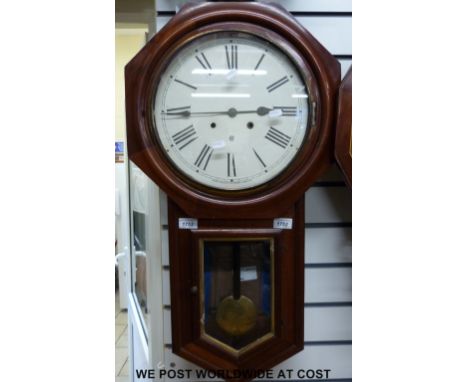 A drop-dial wall striking clock by the USA Waterbury Clock Co with mahogany case, octagonal surround to dial, Roman numerals 