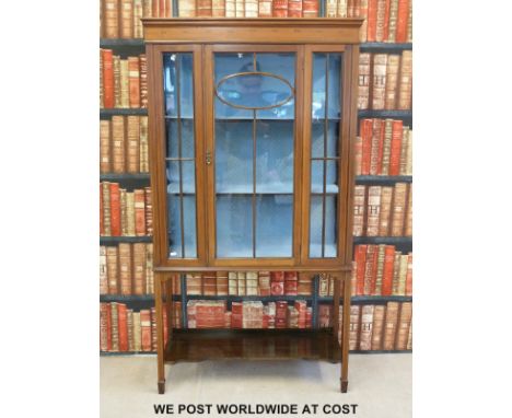 An inlaid late 19thC glazed display cabinet with shelf below (W91 x D32 x H167cm)