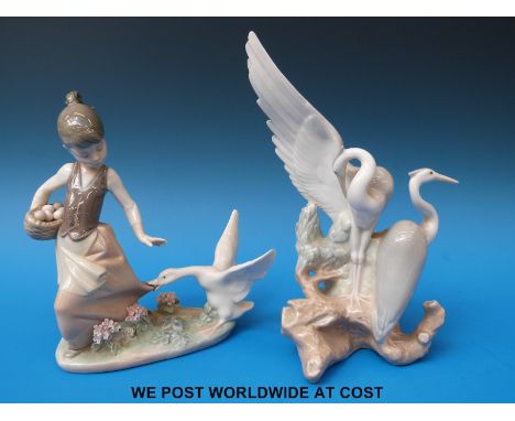 Two Lladro and Nao figures one of herons the other a girl with goose