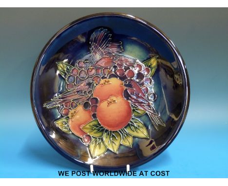 A Moorcroft circular plaque in Finches pattern (diameter 25.5cm)