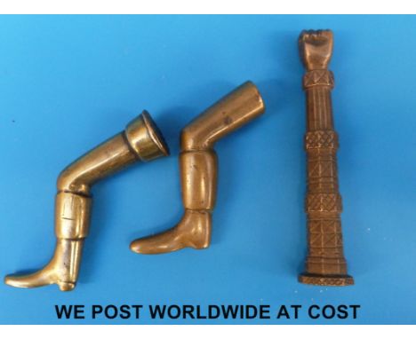 Two 18th/19thC brass tobacco tampers/stoppers in the form of gentleman's legs together with a bronze example in the form of a