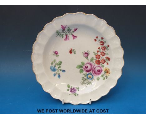 An early Worcester 'Dr Wall' period lobed dessert plate, painted with sprigs of flowers, circa 1760 (diameter approximately 2