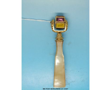 A gilt metal mother of pearl handled intaglio rotary wheel seal, set with seven various hardstone seals each for a day of the