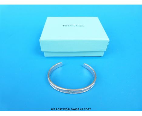 A boxed hallmarked silver Tiffany & Co Roman numeral bangle 