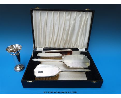 An Art Deco cased silver dressing table set with engine turned decoration and vacant cartouches, Birmingham together with a h