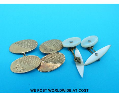 A pair of 9ct gold cufflinks and another pair 