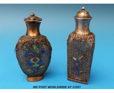 A 19thC white metal and enamel glass scent bottle with all over lacework decoration to each side together with a similar bras