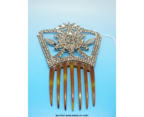 A 19thC cut steel hair comb with star design of small faceted stones 