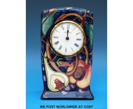 A Moorcroft mantel clock in the Queen's Choice pattern (15cm tall)