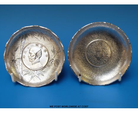 Two Chinese silver coin inset pin trays, marked Sterling Hong Kong, diameter 9cm (116g)