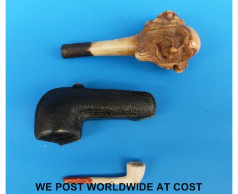 A well carved 18th/19thC bone tobacco tamper/stopper in the form of an old gentleman together with a cased miniature Meerscha