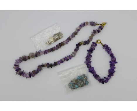 An amethyst necklace with matching bracelet, an enamelled necklace and a lapis set angel pendant