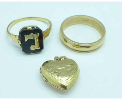 Two 9ct gold rings and a 9ct gold heart shaped locket, total weight 5.6g, K