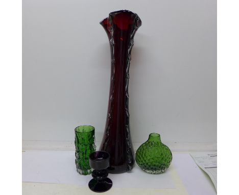 Two Whitefriars green glass vases, Geoffrey Baxter designed bark vase and an onion or puffer fish vase, a Wedgwood aubergine 