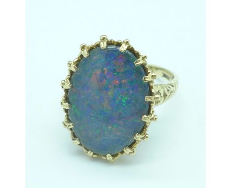 A 9ct gold and black doublet opal ring, 4.8g, N