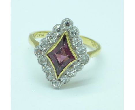 An 18ct gold, platinum, red stone and diamond ring, 4.2g, M