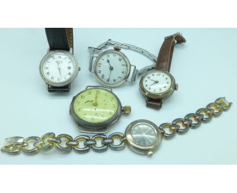 Five silver cased wristwatches including Rotary