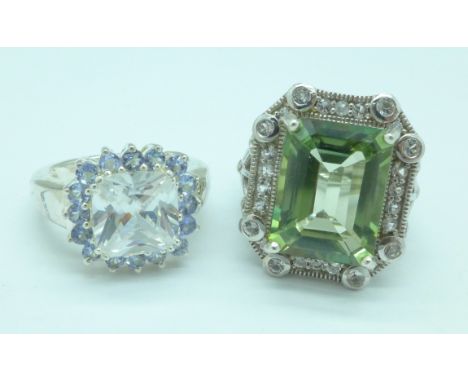 Two large silver rings; tanzanite set and cubic zirconia and green quartz set, R and O