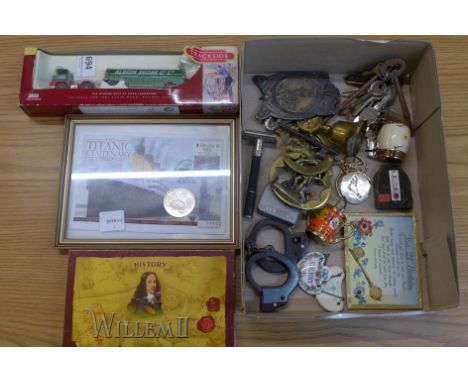 An R.M.S. Titanic Centenary five pounds coin, a Lledo Collectables Trackside lorry, keys, an Art Nouveau plaque, etc.