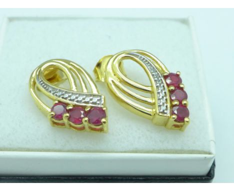 A pair of silver gilt ruby earrings