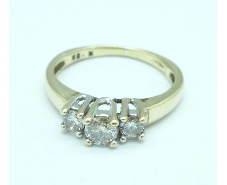 A 9ct gold and three stone diamond ring, 2.7g, L