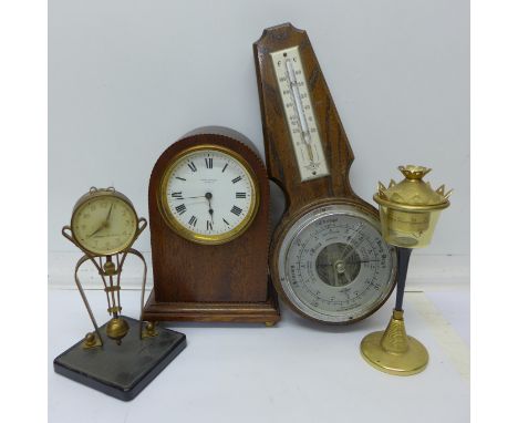 An arched top mahogany cased mantel clock, retailed by Mappin & Webb, London, a Meiko swinging clock, an English barometer an