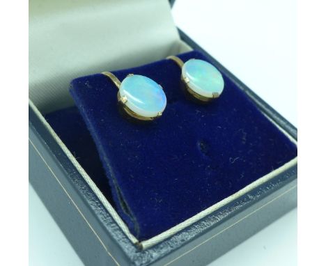 A pair of 9ct gold and opal earrings, screw back