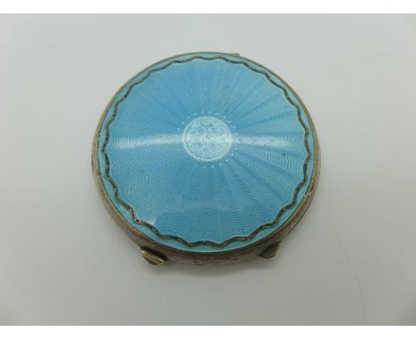 A guilloche enamel compact