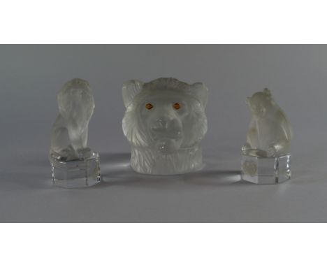 A collection of three paper weights modelled as glass animals, 20th century, to include one lion head and two other smaller o