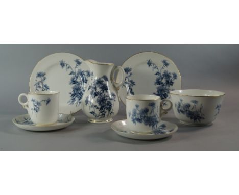 A Royal Worcester porcelain part tea service, retailed by Maple and Co,  printed with sprays of blue flowers to comprise seve