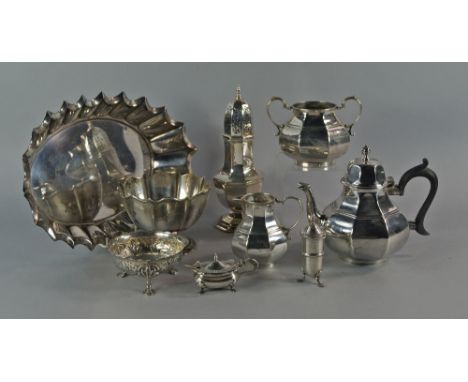 A Victorian silver bachelors tea service, London 1881 and 1885, William Hutton & Sons (Edward Hutton) of bulbous faceted form