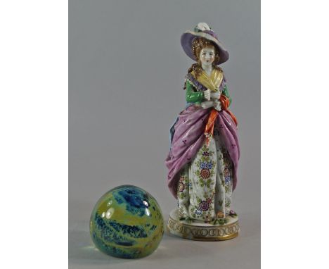 A Continental porcelain figure of a lady, late 19th/20th century, in a floral dress with pink underskirts, damages, 26cm high