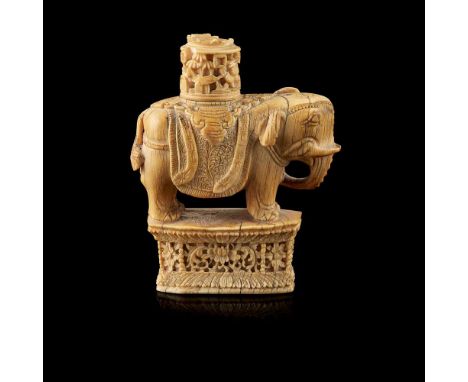 Y CARVED IVORY CHESS PIECE QING DYNASTY, 19TH CENTURY&nbsp;清 象牙雕象棋子 carved as a standing elephant with circular tower, the tr