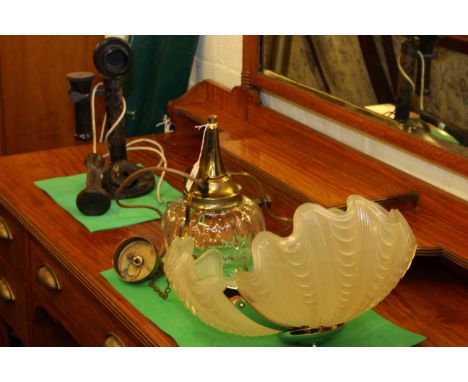 Vintage stick telephone, light fitting and glass shade