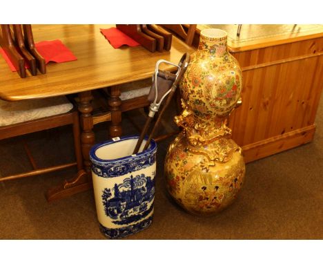 Large Oriental double gourd vase with applied dragon design blue and white stick stand, shooting stick and silver mounted wal