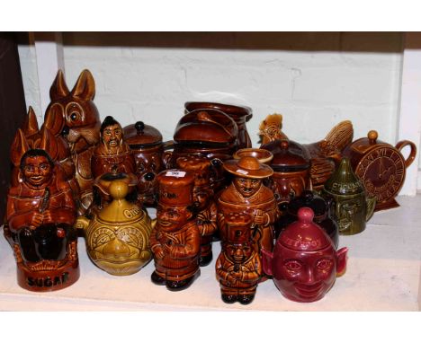 Assorted pottery storage jars, hen basket, teapot, etc