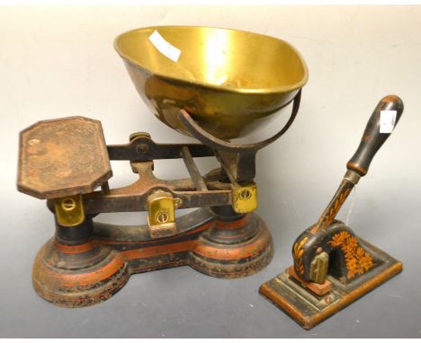 A set of Parnall & Son cast iron shop scales, brass bowl, a tower of Avery brass weights;  a Victorian cast iron stamp press,