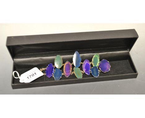 A banded and fortification agate multi-colour panel bracelet, ten individual panels, mounted to a white metal double row chai