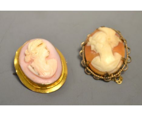 An Edwardian shell portrait brooch, maiden facing right, 9ct gold frame, another facing left, 9ct gold frame, 9.7g gross ( 2 