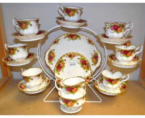 An  Old Country Roses tea service for seven, comprising side plates, cups and saucers, creamer and sugar bowl, cake plate.