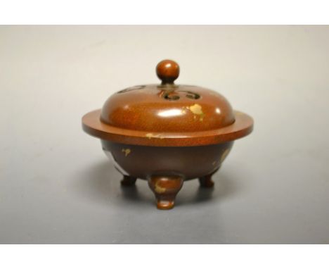 A small gold splashed bronze censor bowl and cover, cast six character marks, tripod feet 