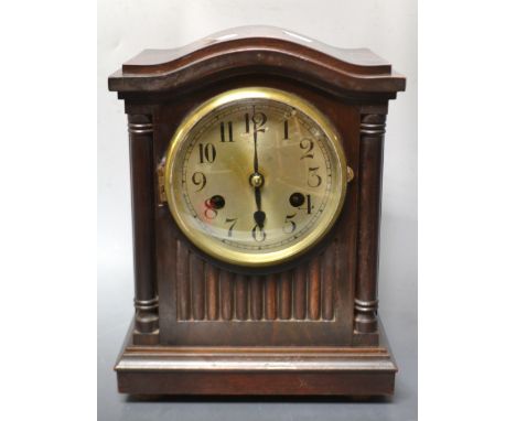 A Schatz German mahogany cased chiming mantel clock, silvered dial, Arabic numerals, arched top, 