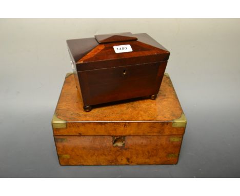 A mahogany sarcophagus shaped tea caddy; a walnut writing slope ( 2 ) 